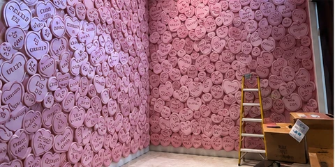 Custom pink conversation-heart wall installation